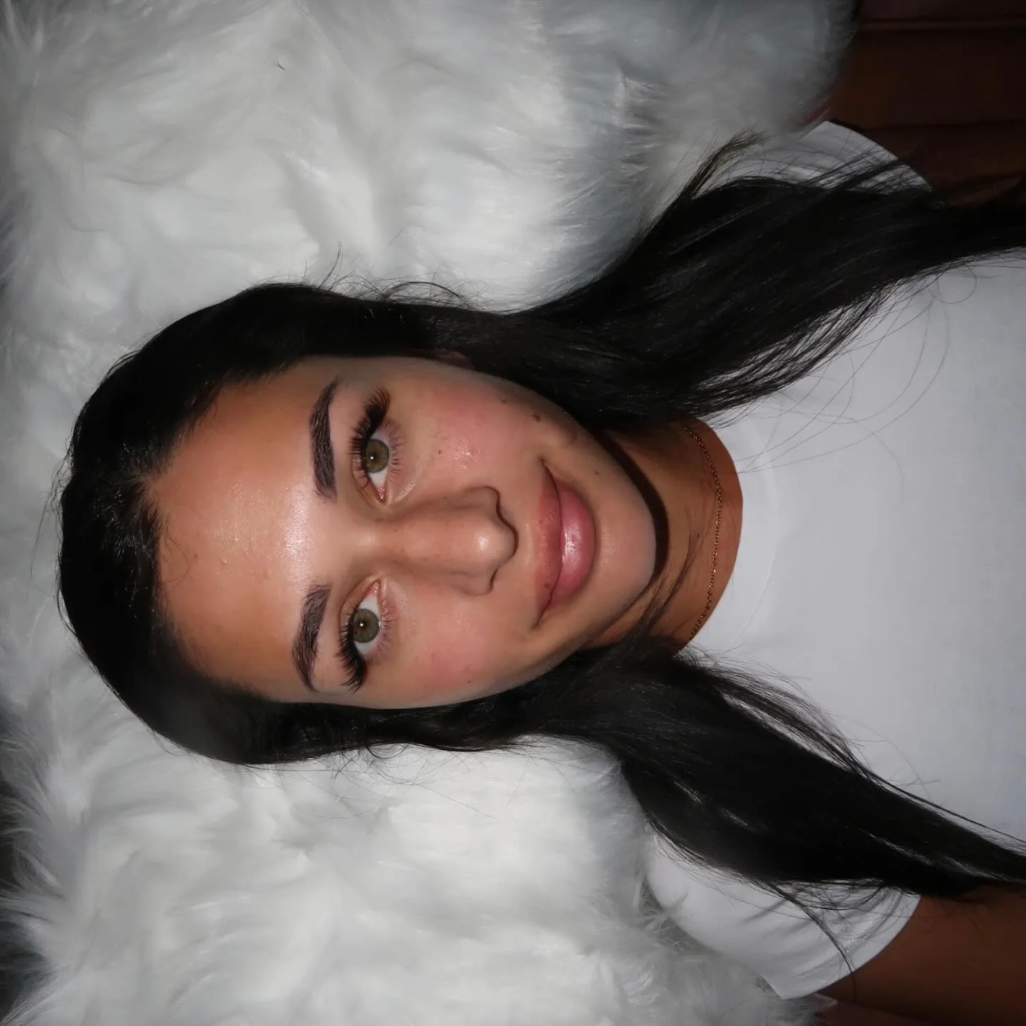 Full face, brunette, both hazel eyes with wispy lashes, white fur