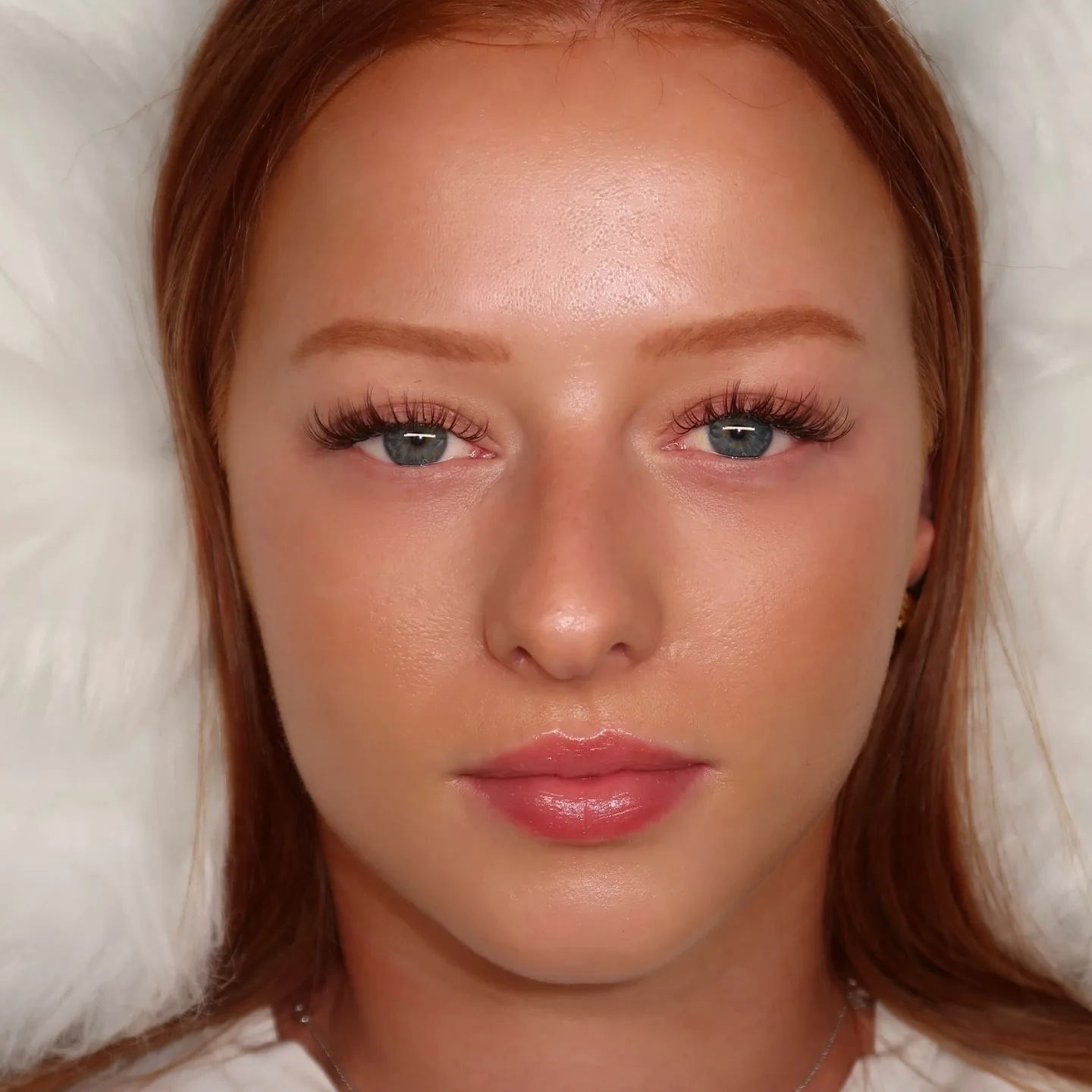 Full face, redhead, both eyes with wispy lash extensions, white fur